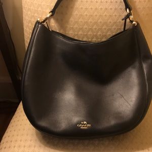 Navy blue coach bag with gold detailing